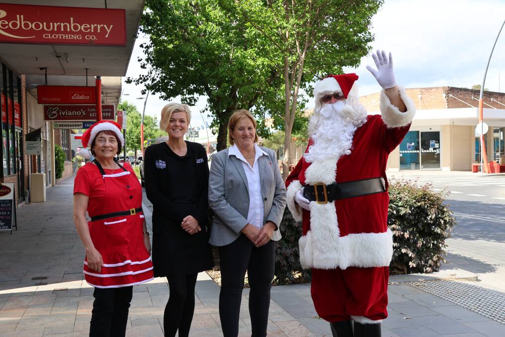 Singleton Rotarys Isabella Bailey and Santa with Business Singletons Laura Kelly and Singleton Mayor Cr Sue Moore. Picture supplied 