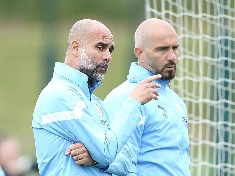 Pep Guardiola will face former assistant Enzo Maresca (r) in the Premier League opening round. (EPA PHOTO)