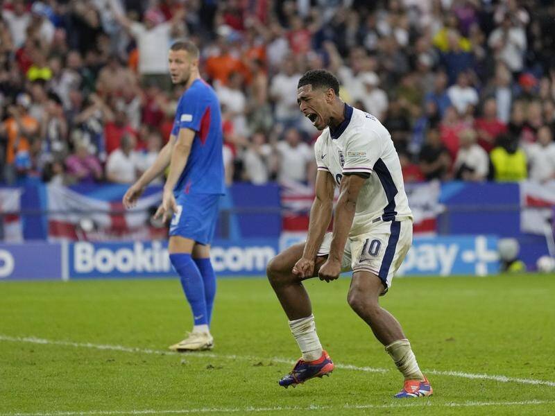 England's Jude Bellingham celebrates during the 2-1 defeat of Slovakia in Gelsenkirchen on Sunday. (AP PHOTO)